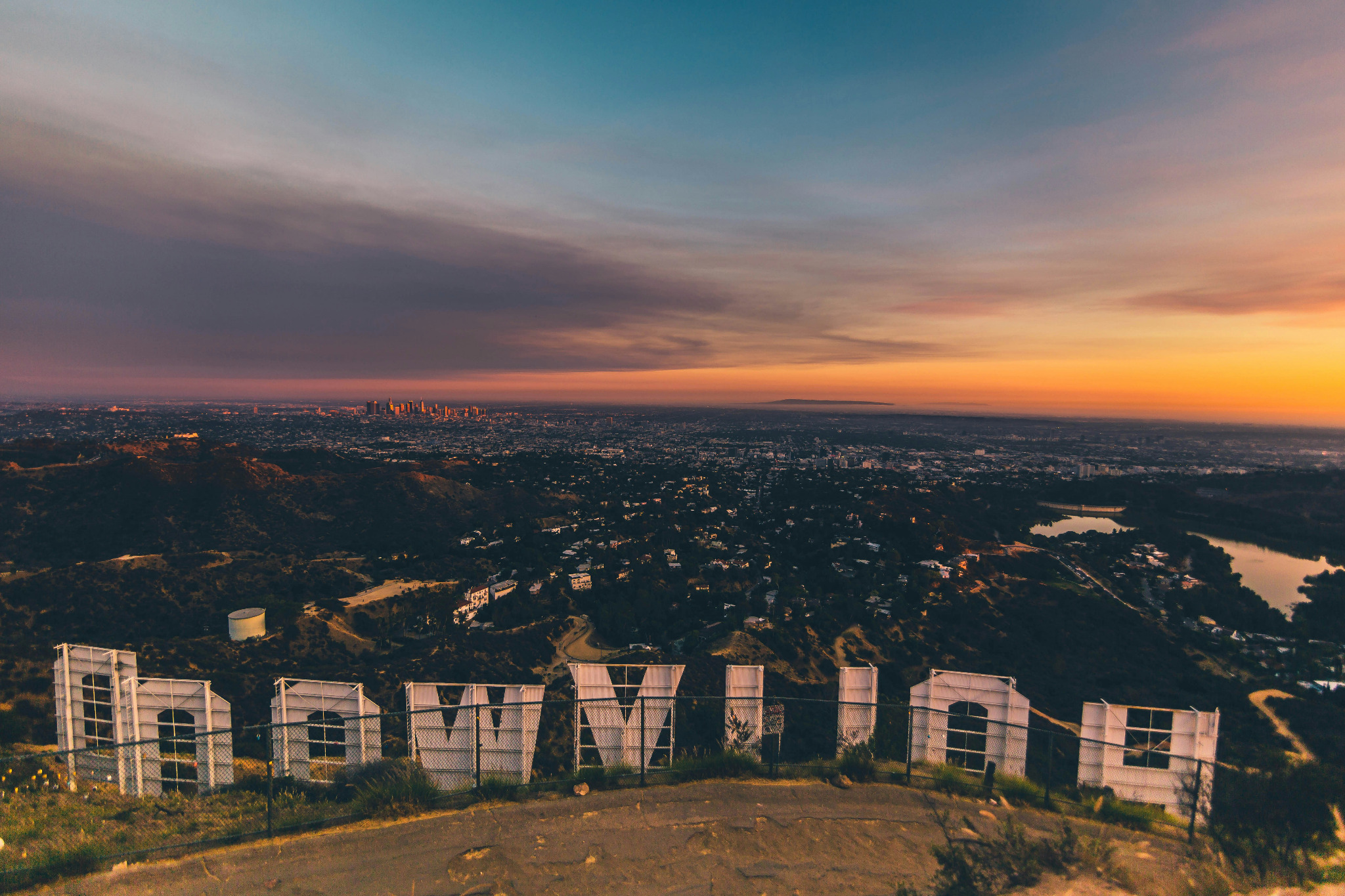 The back of the Hollywood Sign overlooking Los Angeles at sunset
